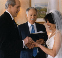 Rabbi Steve Mason presides over interfaith marriage services.